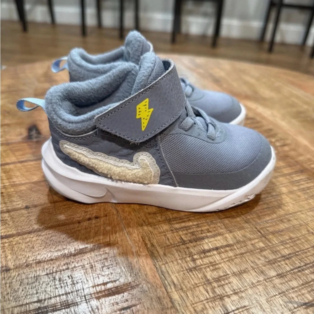 Kids Gray Nikes with lightning bolt